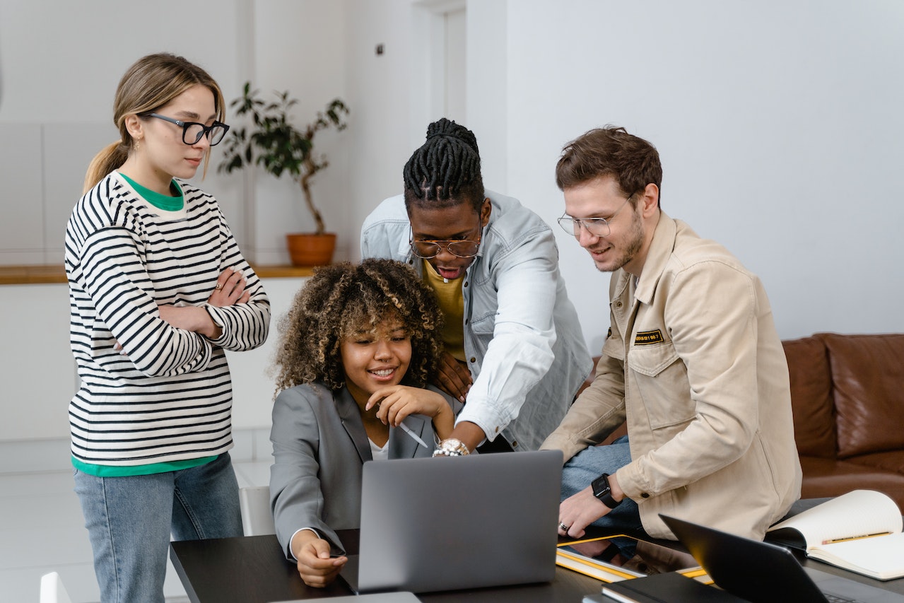 group of people working at a computer