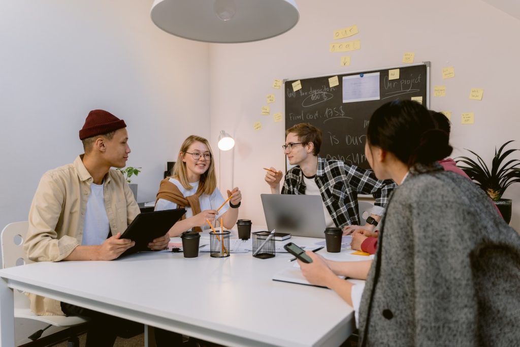 group of people in a conference room working