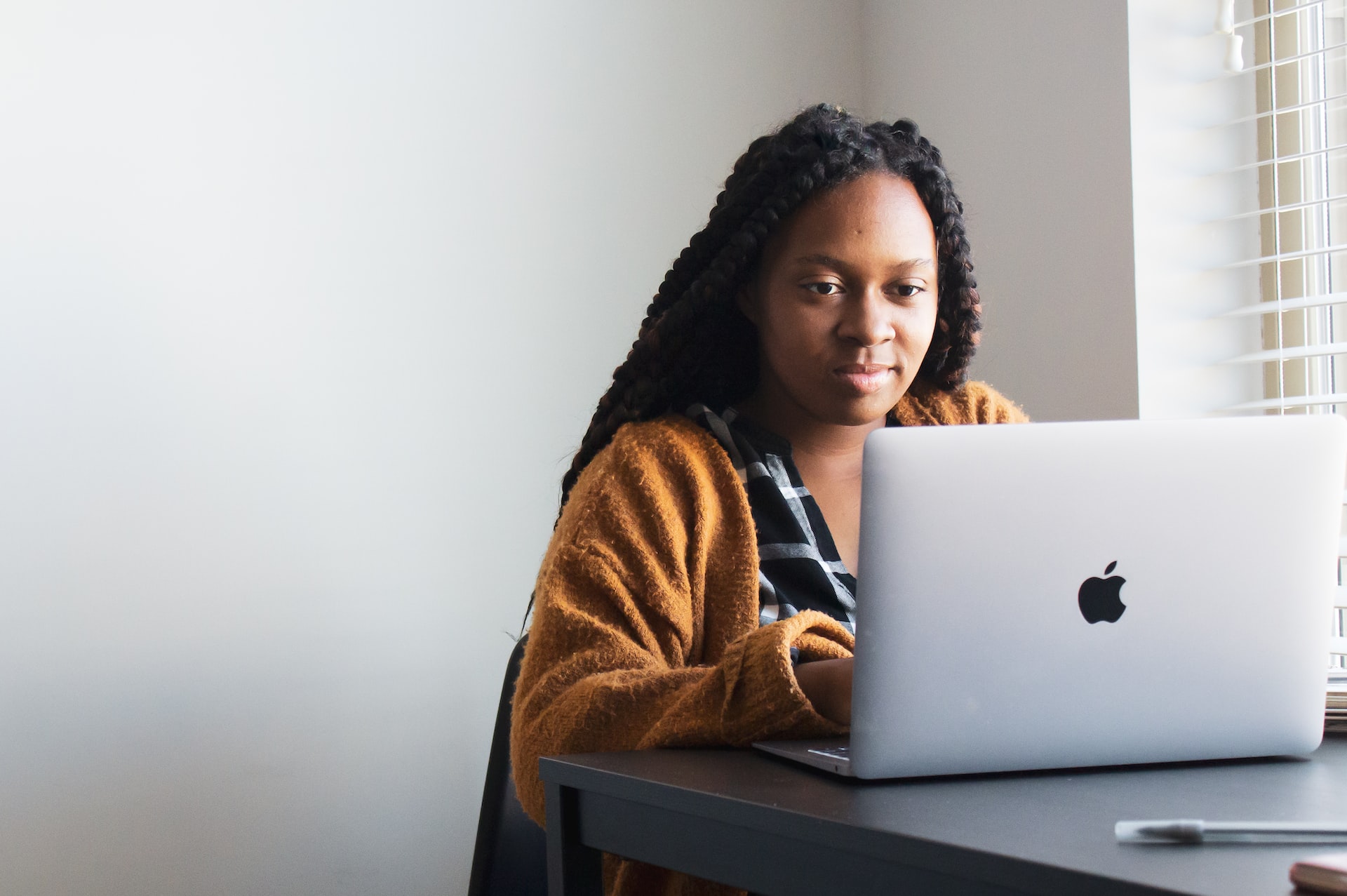 woman typing on laptop