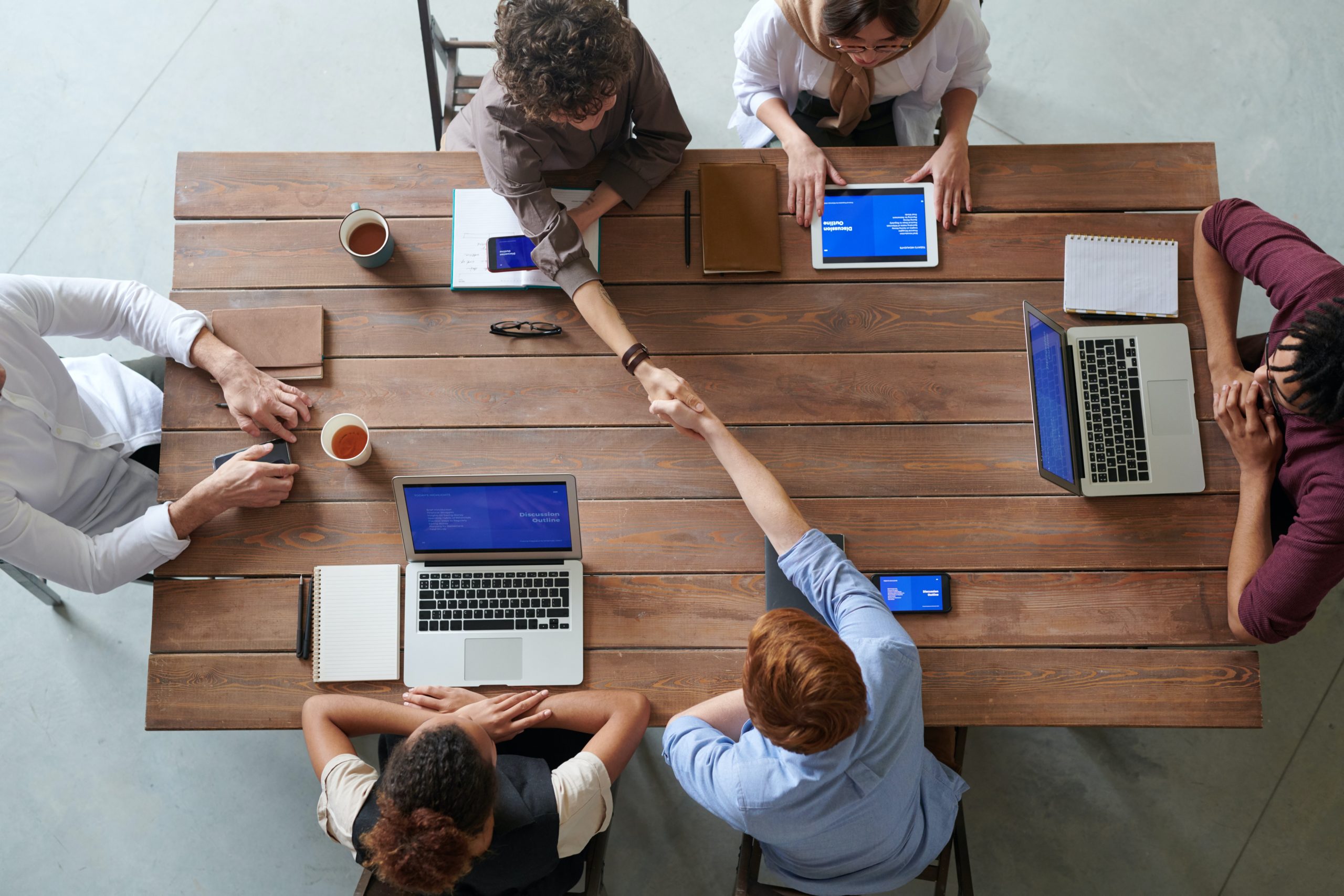 group of people in an office working at a conference table