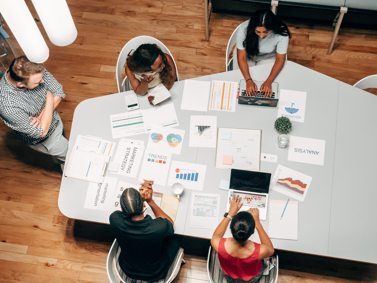 group of people working at a conference table on digital ads